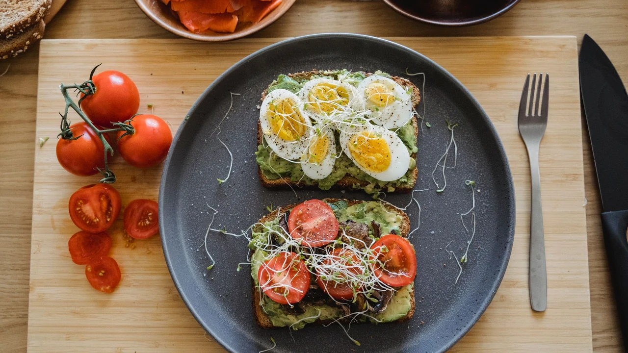 Breakfast plate with sliced wraps, tomatoes and avocado