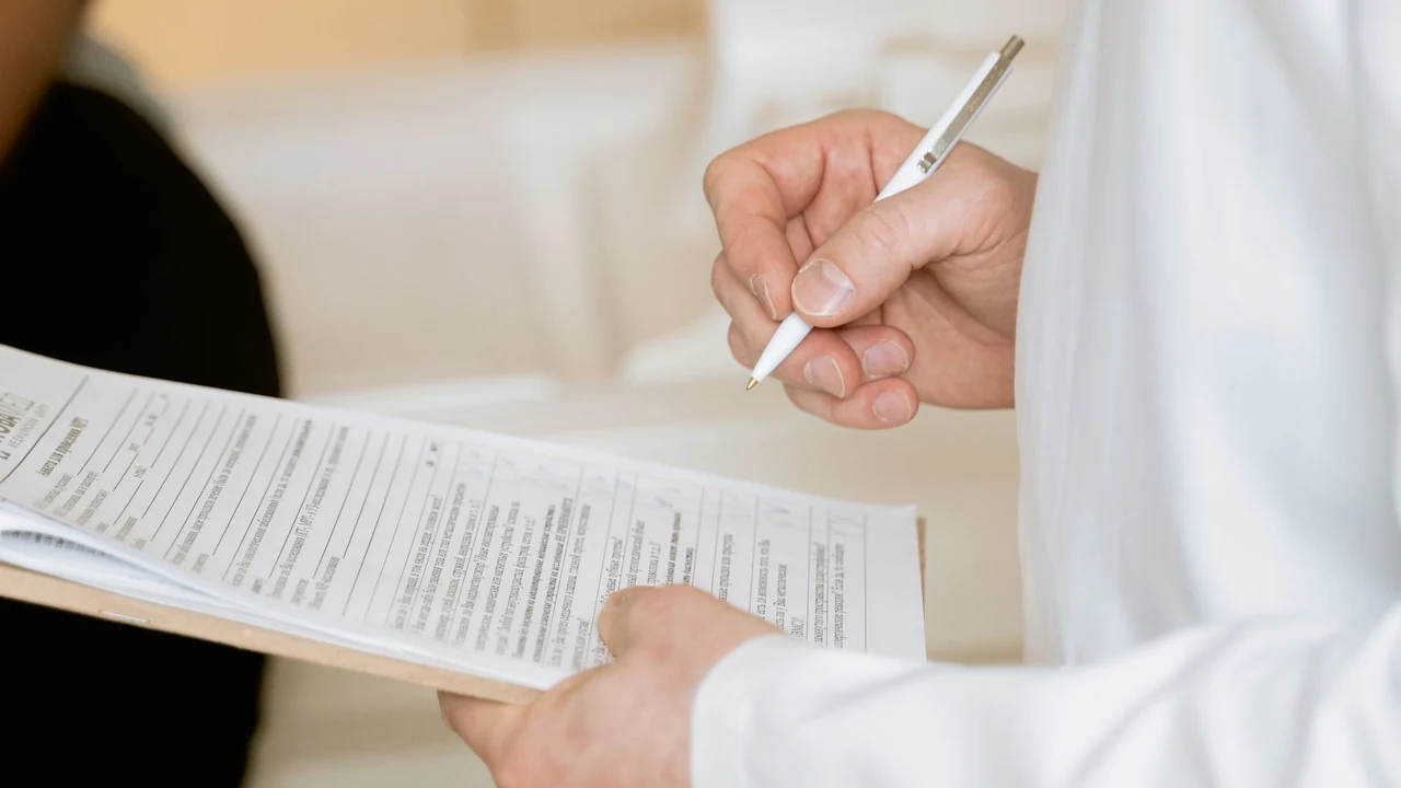 Clinician reviewing a printed medical form
