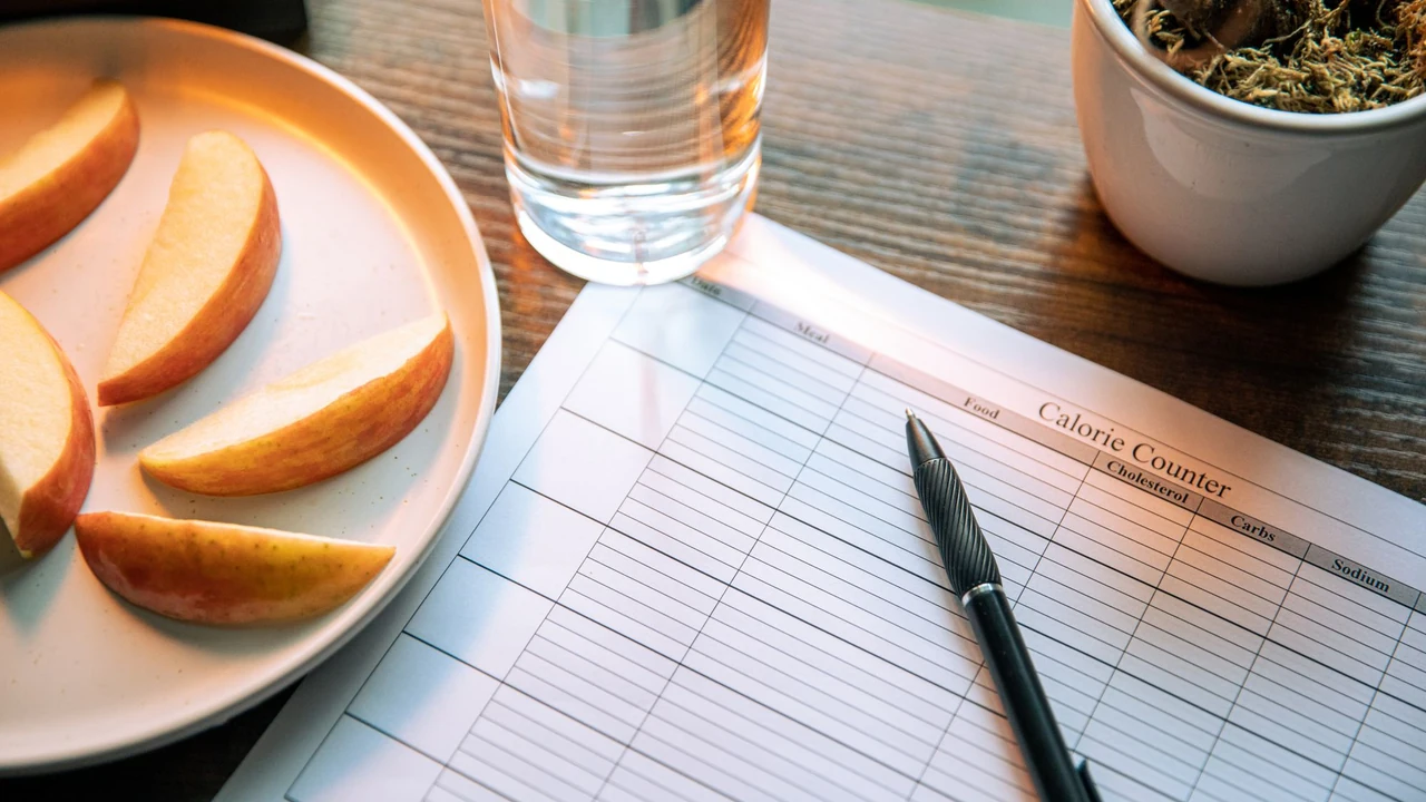 Open notebook and orange slices on a table