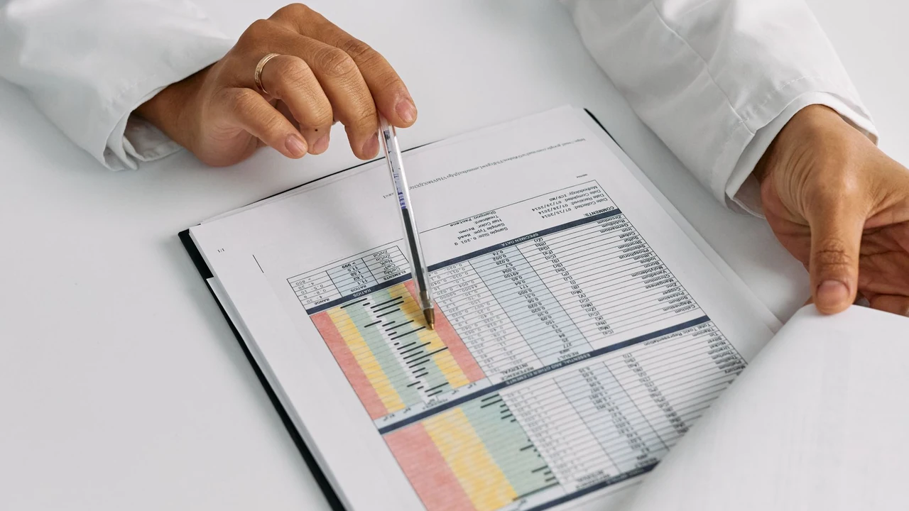 Clinician reviewing a printed chart
