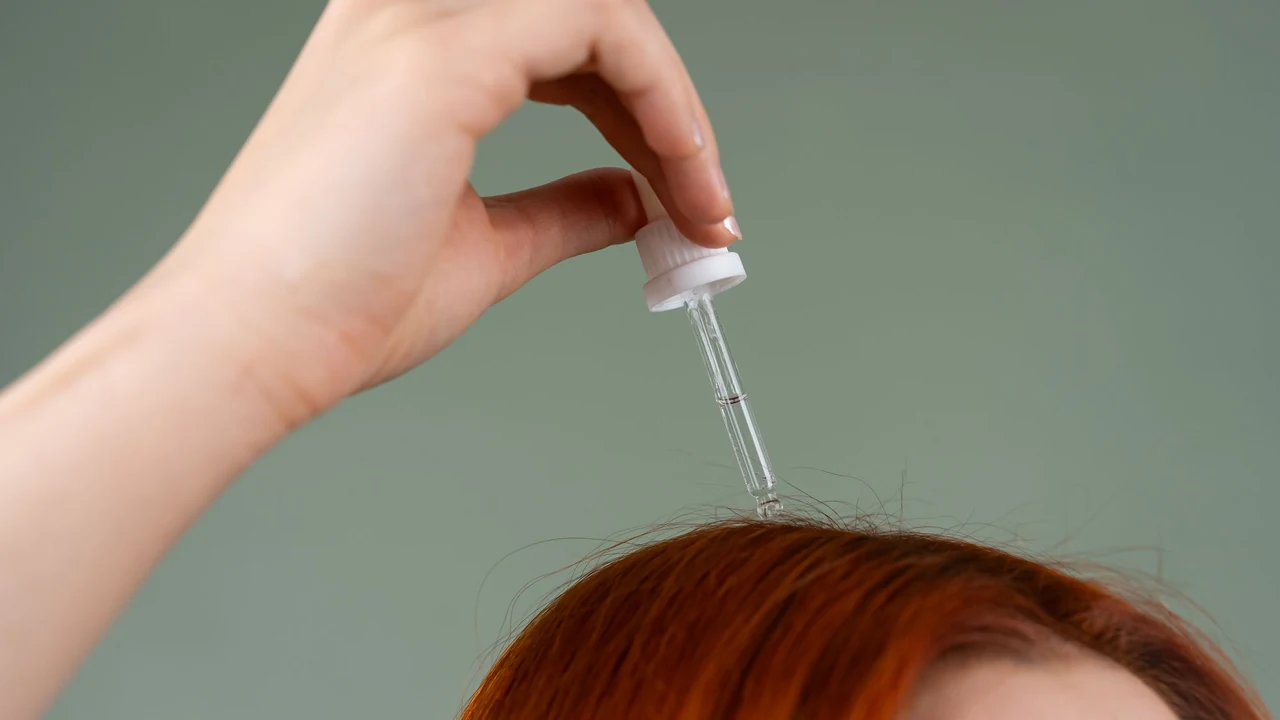 Dropper held above a person's hair
