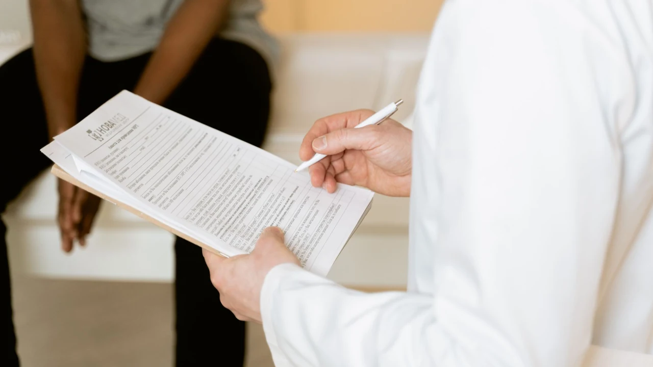 Clinician and visitor reviewing a document