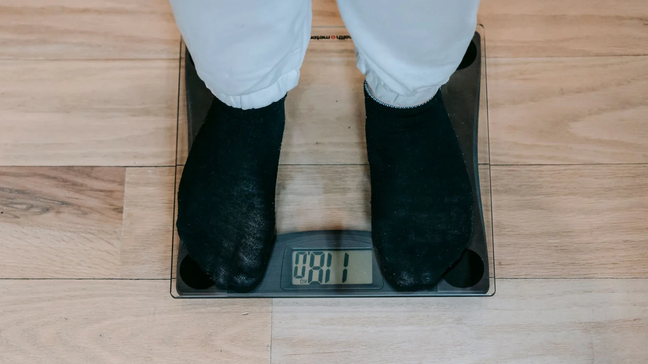 Feet on a digital scale on a wooden floor