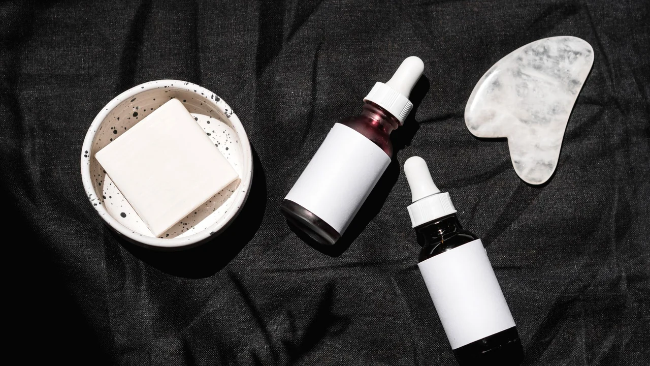 Cosmetic skincare containers arranged on a surface.