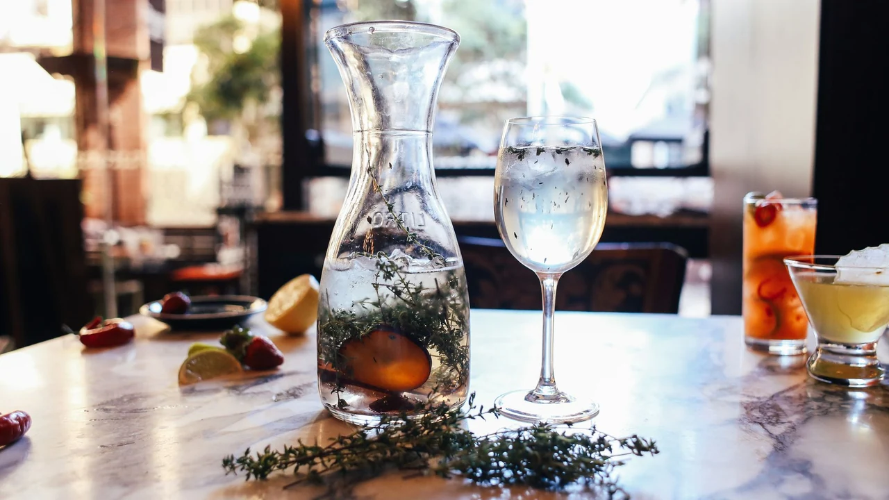A glass of water on a dining table.