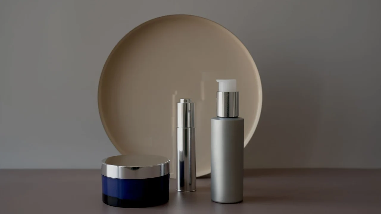 Unbranded cosmetic bottles and a cream jar on a display