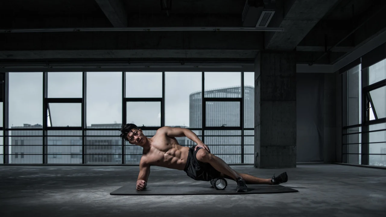 Man using a foam roller on the floor