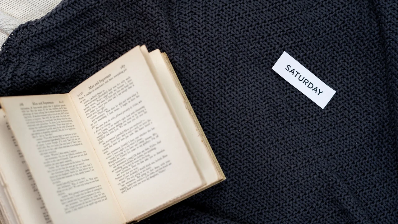 Open book resting on a blanket.