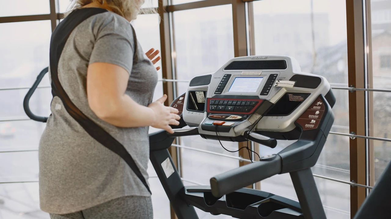 Woman walking on a treadmill.
