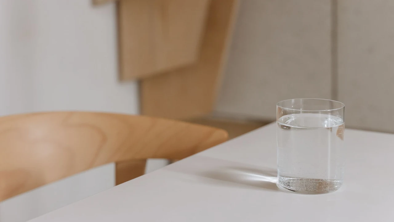 A clear glass of water on a light table