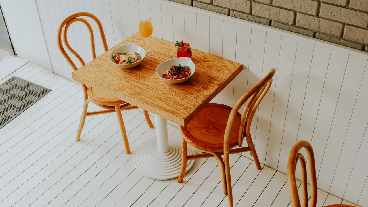 Two place settings on a small dining table