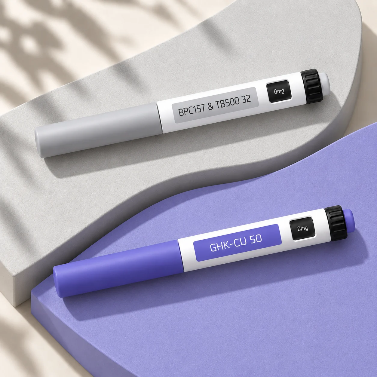 BPC-157 + TB-500 32 mg and GHK-Cu 50 mg closed pens on silver and violet planes